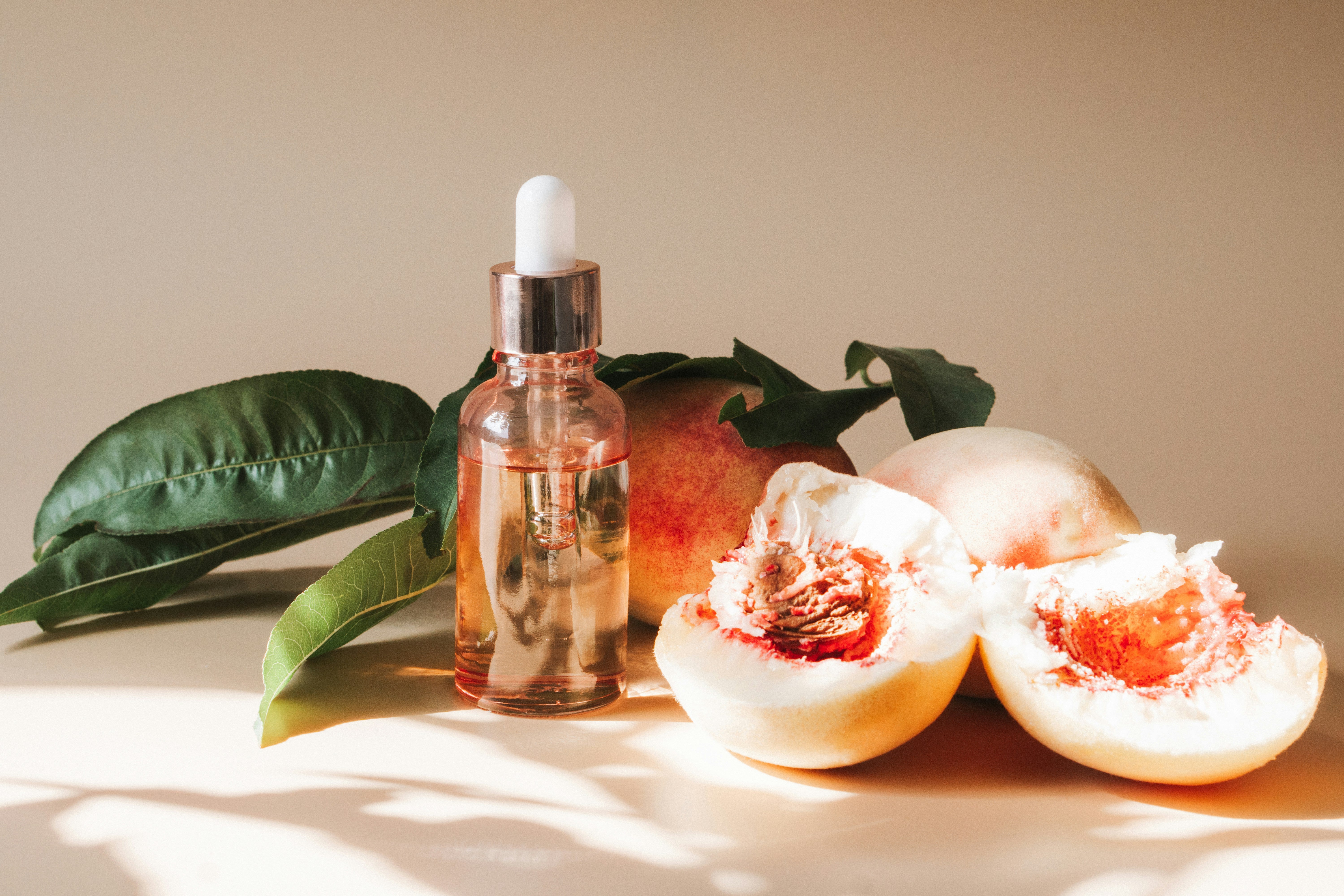 Organic skincare serum drop infused with fruit-based ingredients